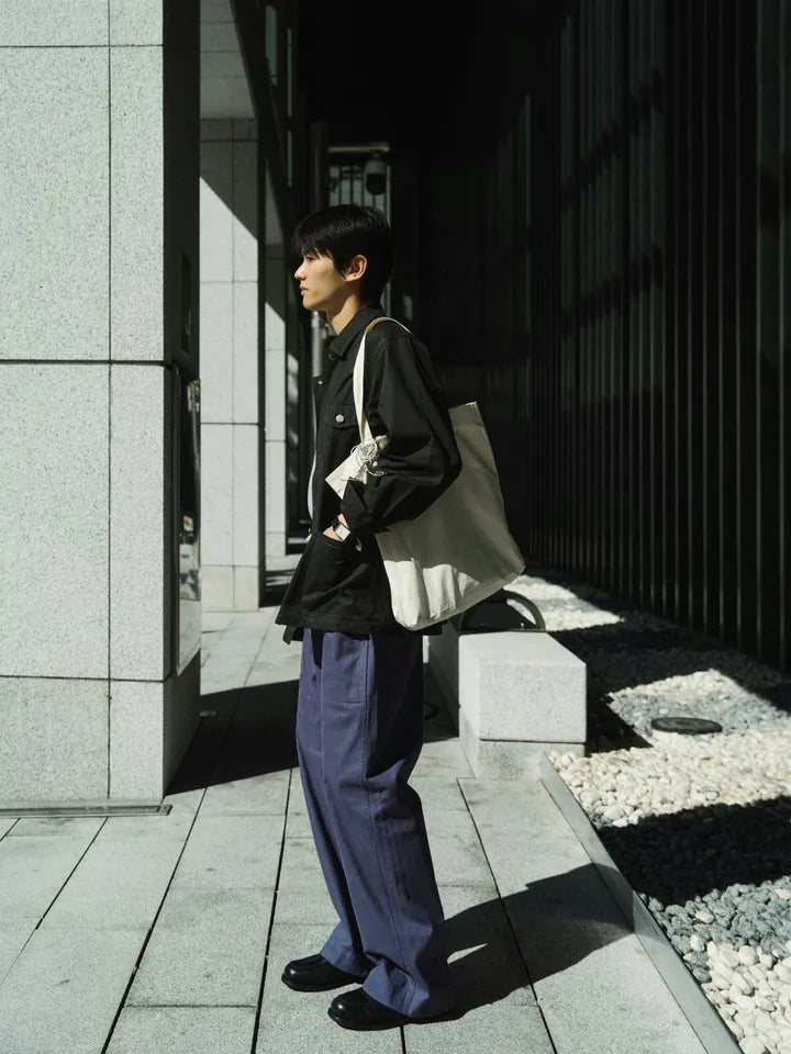 A charcoal jacket and blue pants on an afternoon in the alley — 3