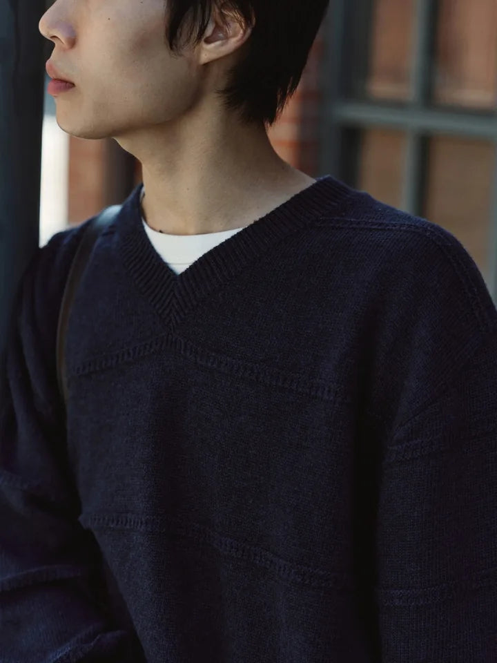 

A navy V-neck and black chinos on a clear afternoon — 6