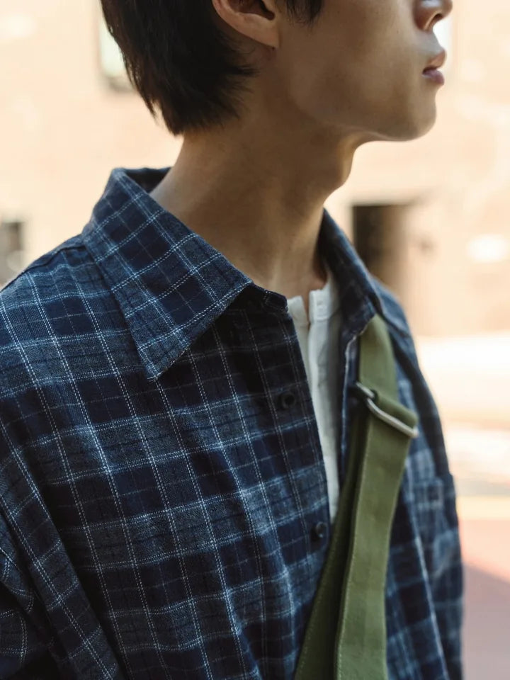 

A check shirt and purple denim between sun and shade — 5
